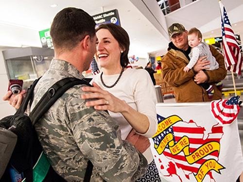 Serviceperson reuniting with loved ones