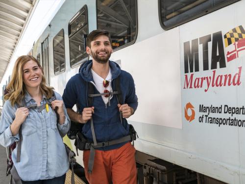 Backpackers getting off the train